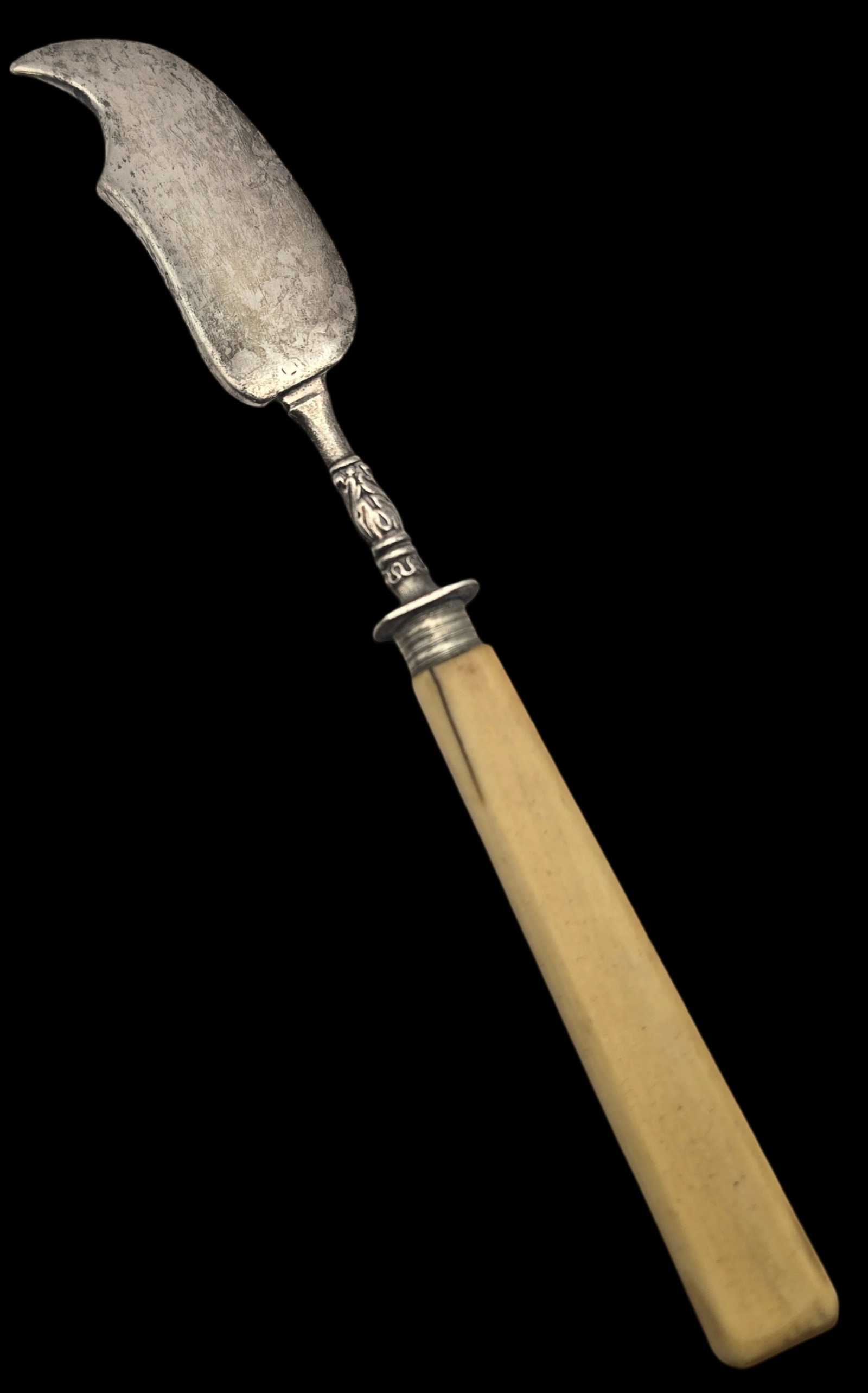 Antique 19th Century European Silver Butter Knife: Good vintage condition with some wear and patina according to age; small crack to handle. Measures approx. carries unidentified hallmarks.