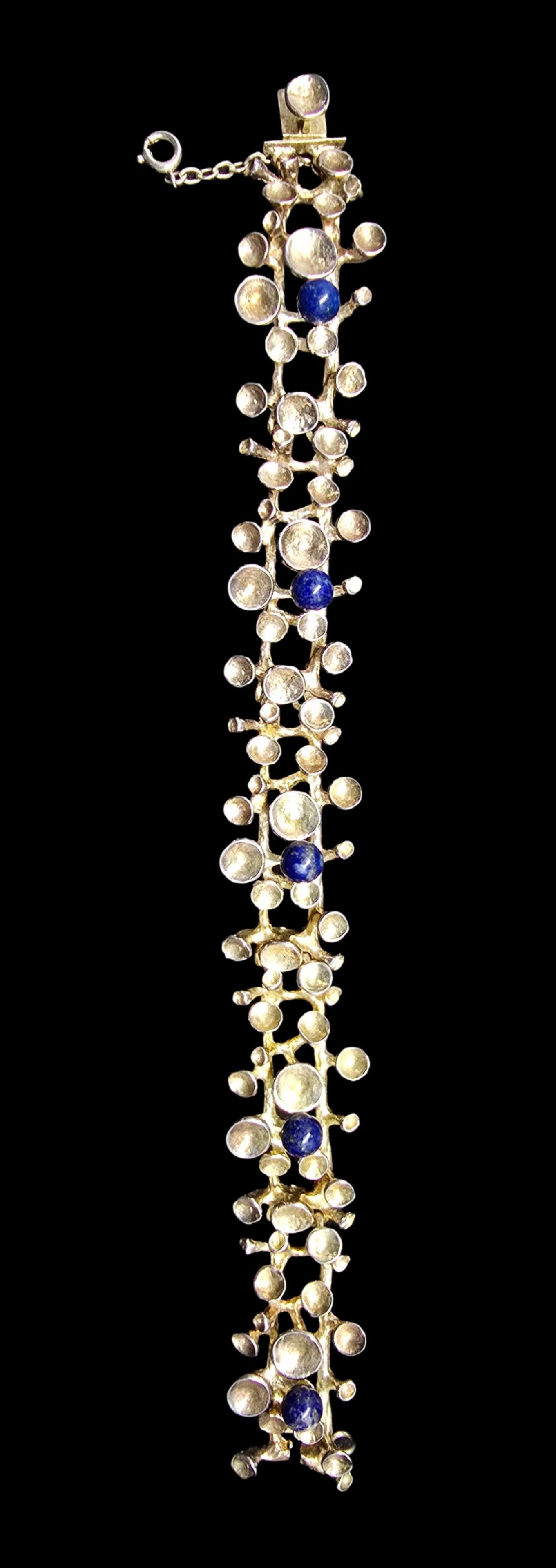 Stunning Vintage Mid-Century Modern Brutalist Sterling Silver & Blue Gemstone Bracelet: Very good vintage condition with minor patina according to age. Measures approx. 1/2" wide and weighs ca. 48 grams. Marked for Sterling Silver.