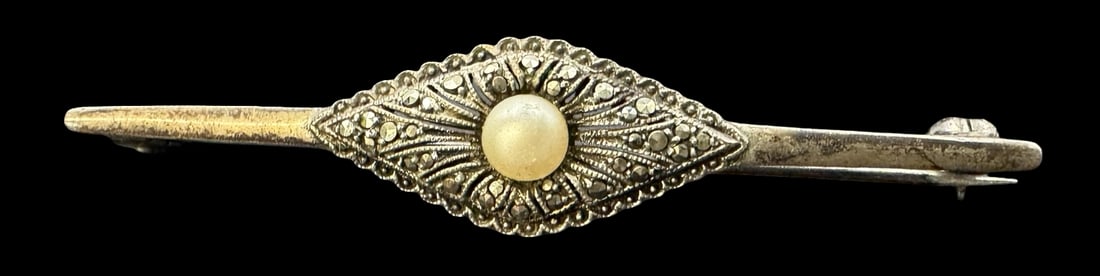 Vintage Sterling Silver Brooch& Marcasite Gemstones & Pearl: Very good vintage condition with minor patina according to age. Measures approx. 2 3/8" long x 1/2" wide and weighs ca. 16.9 grams. Marked for Sterling Silver..