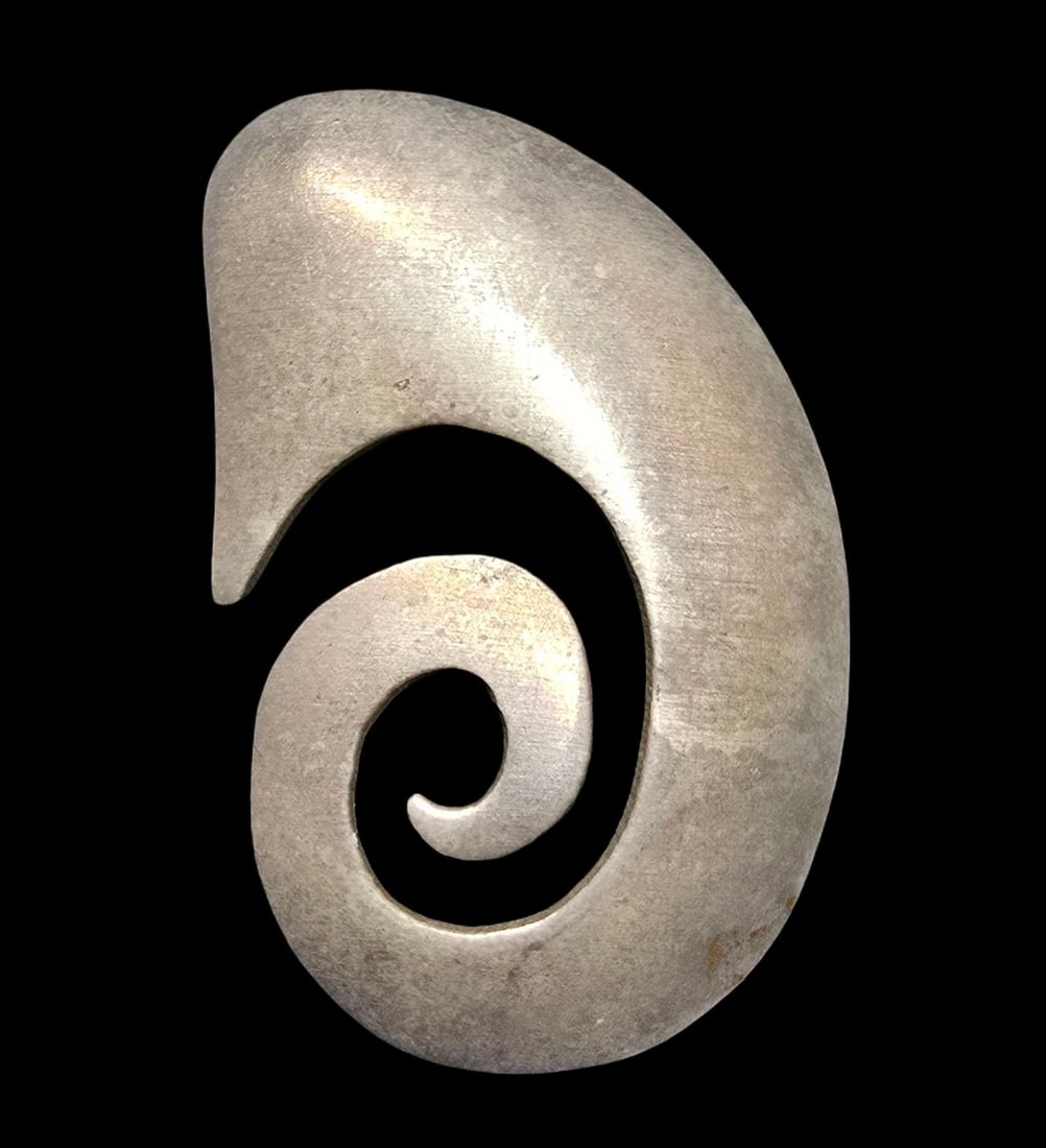 Stylish Vintage Mid-Century Sterling Silver Shell Spiral Koru Pendant: Very good vintage condition with minor patina according to age. Measures approx. 1 1/2" wide and weighs ca. 4 grams. Marked for Sterling Silver.