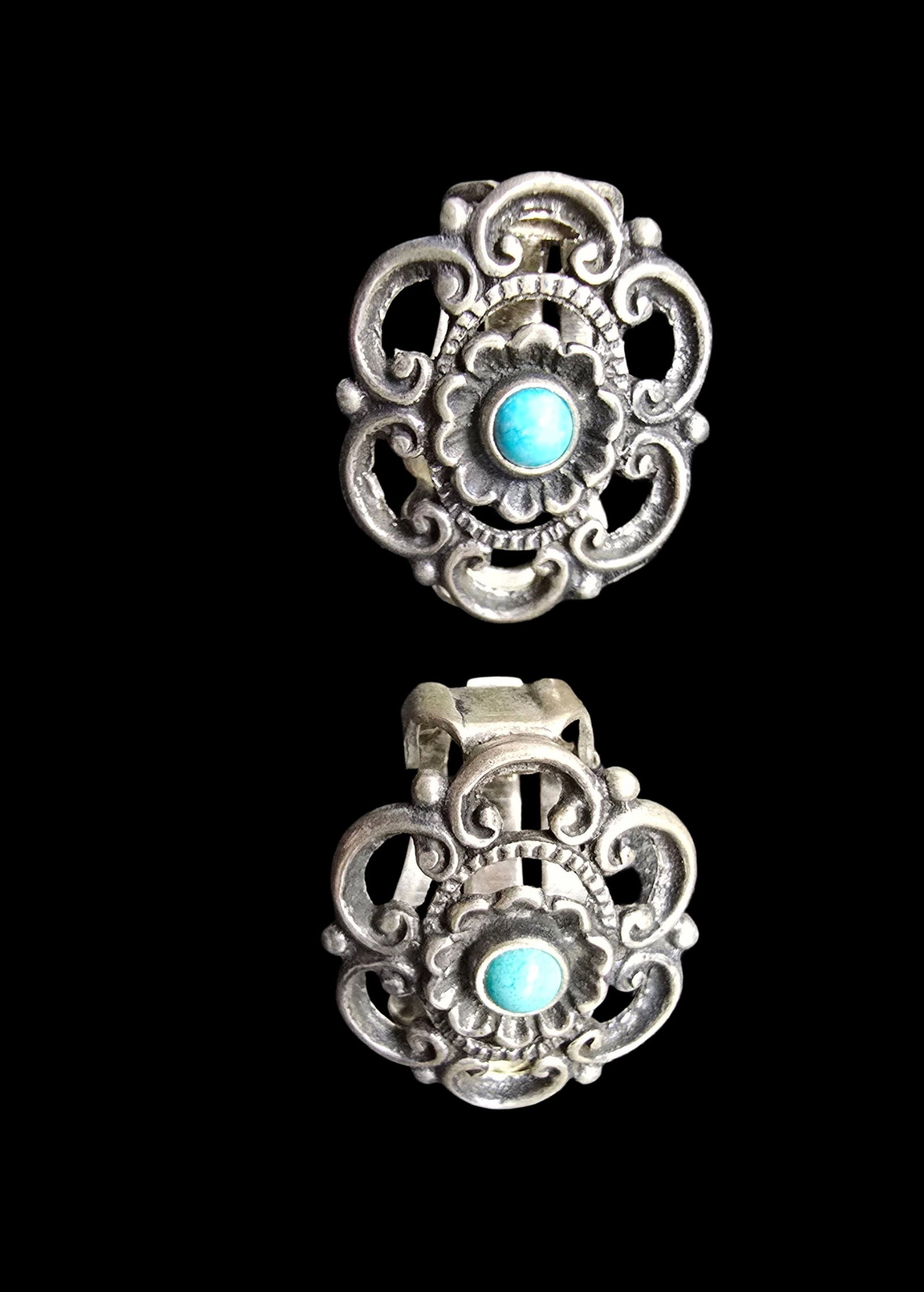 Ornate Vintage Sterling Silver & Turquoise Clip-On Earrings: Very good vintage condition with minor patina according to age. Each measures approx. 1" wide and they jointly weigh ca. 6.5 grams. Marked for Sterling Silver.