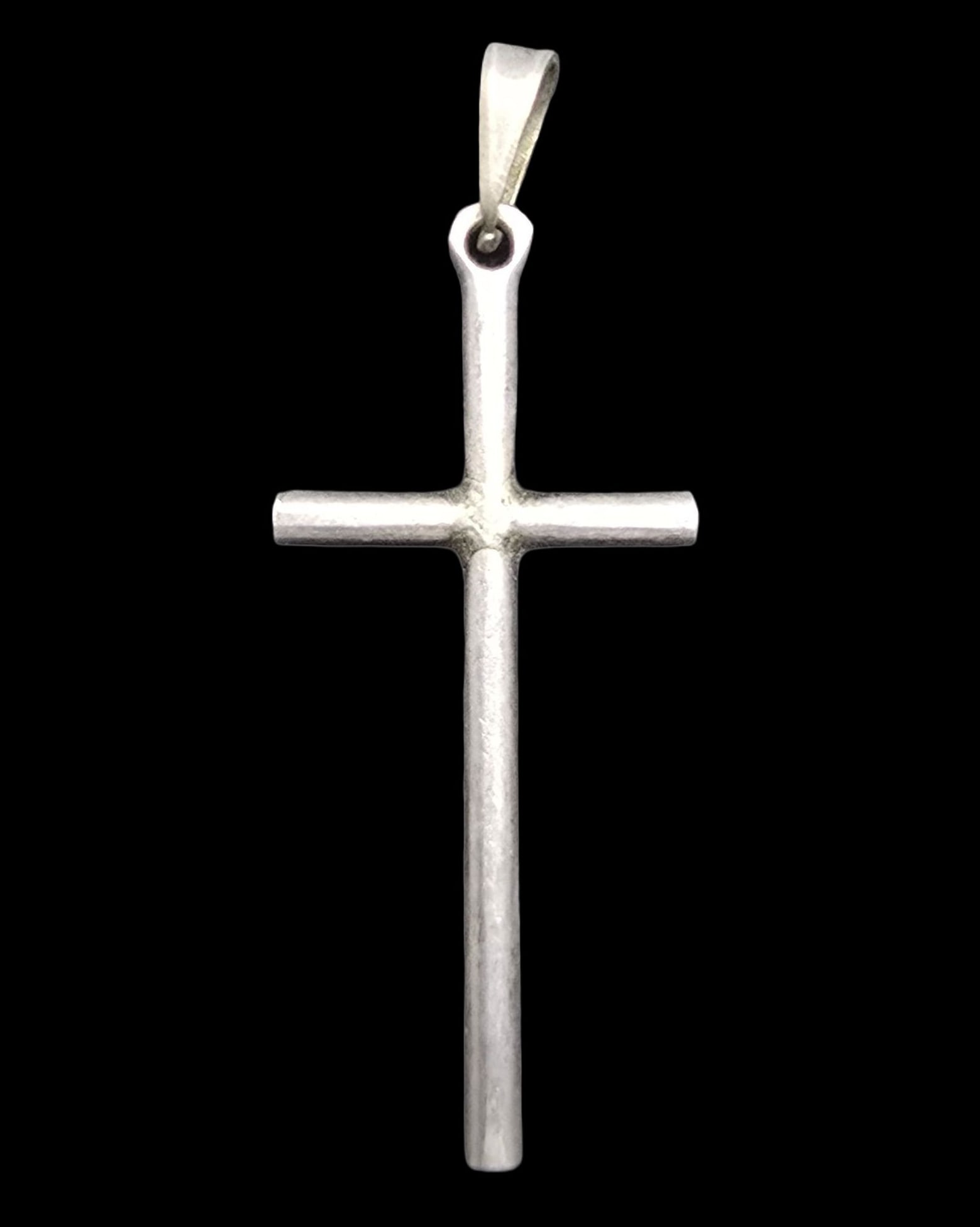 Stylish Vintage Sterling Silver Cross Pendant: Very good antique condition with minor patina according to age. Measures approx. 1 1/2" long and 1/2" wide and weighs ca. 1.5 grams. Marked for Sterling Silver.