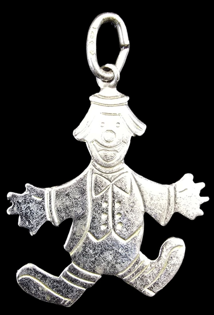 Whimsical Vintage Sterling Silver Clown Pendant Charm: Very good vintage condition with minor patina according to age. Measures approx. weighs ca. 1 gram. Marked.
