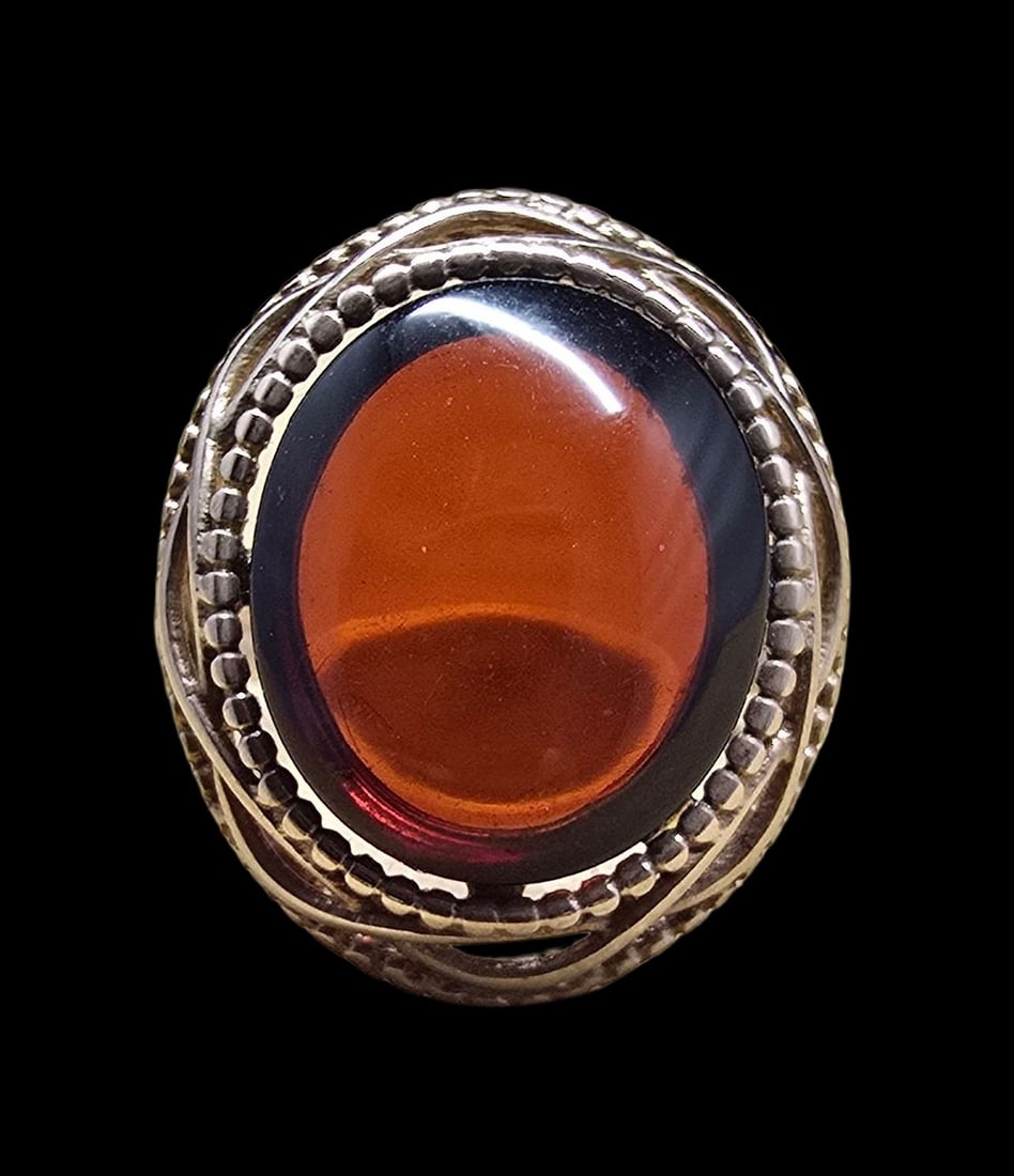 Ornate Vintage Sterling Silver & Amber Ring: Very good vintage condition with minor patina according to age. Measures approx. 1" wide and weighs ca. 3.5 grams. The ring is a size 6. Marked for Sterling Silver.