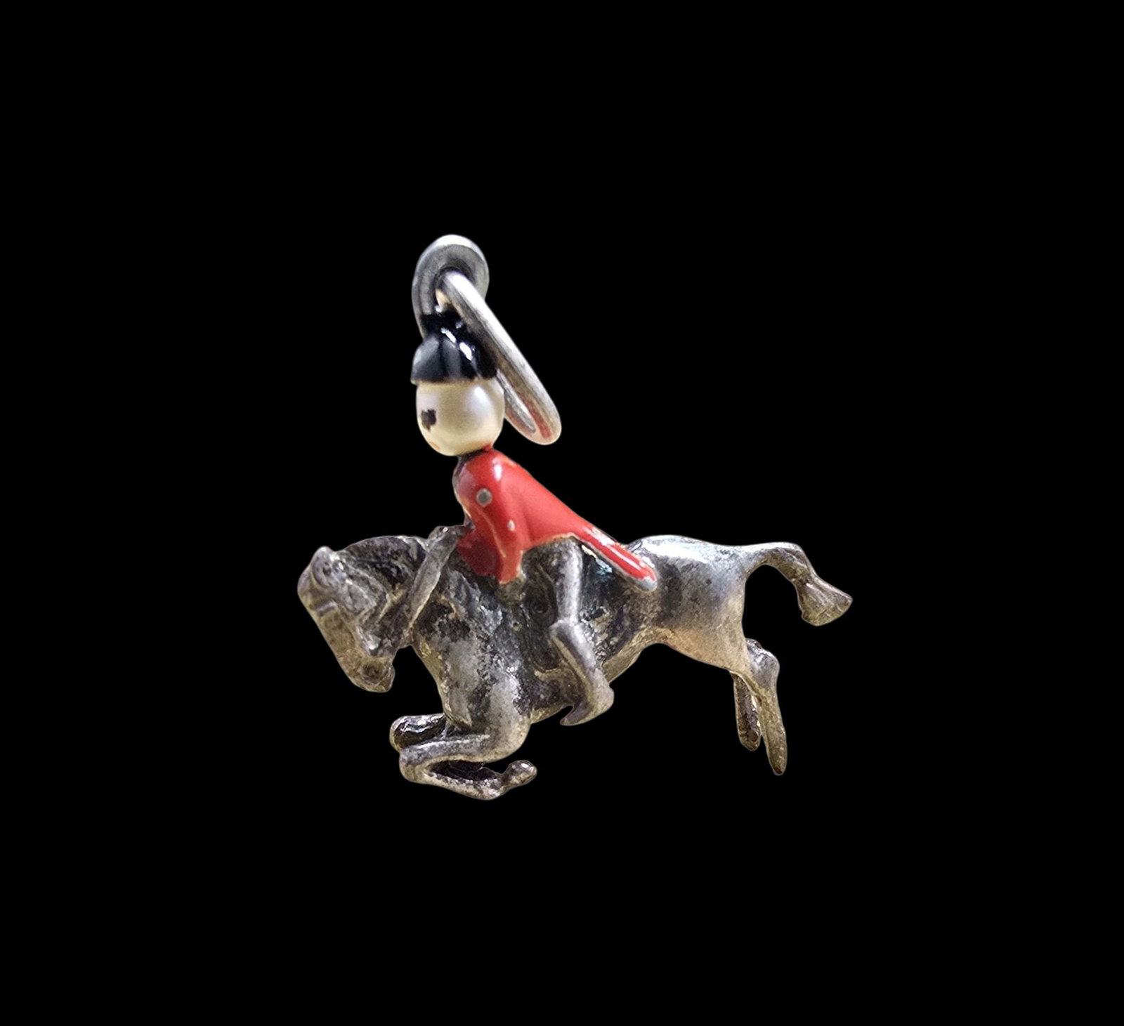 Unusual Vintage Sterling Silver British Cavalry Rider & Horse Pendant Charm: Very good vintage condition with minor patina according to age. Measures approx. 1" wide and weighs ca. 3.5 grams. Tested for Sterling Silver.