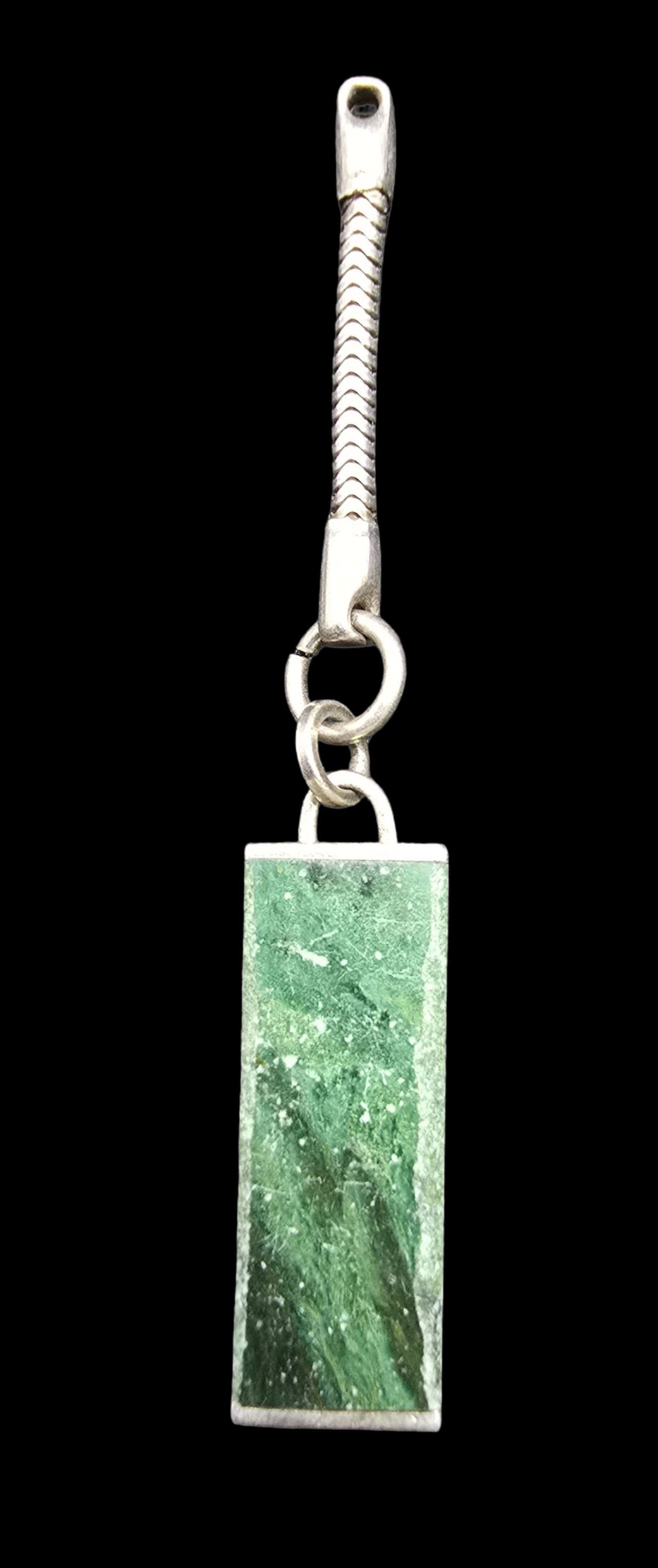 Vintage Sterling Silver & Green Gemstone Pendant: Very good vintage condition with minor patina according to age. Measures approx. 2 1/2" long and 1/2" wide and weighs ca. 8 grams. Marked for Sterling Silver.