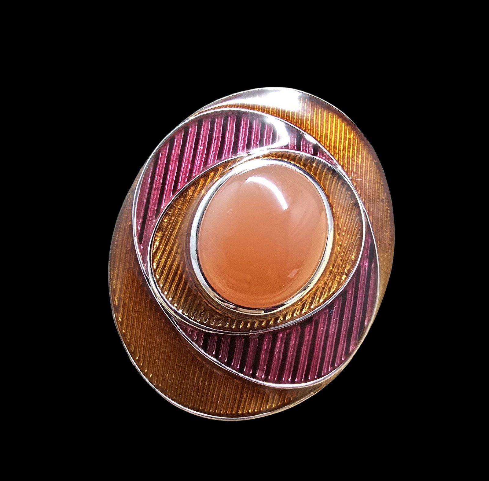 Unusual Vintage Sterling Silver, Guilloche Enamel & Orange Gemstone Ring: Very good vintage condition with minor patina according to age. Measures approx. 1" wide and weighs ca. 11 grams. The ring is a size 7. Marked for Sterling Silver.