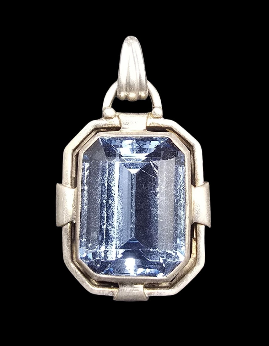 Beautiful Vintage Art Deco Sterling Silver & Blue Gemstone Pendant Charm: Very good vintage condition with minor patina according to age. Measures approx. 1 1/2" long and 1" wide and weighs ca. 7.5 grams. Marked for Sterling Silver.
