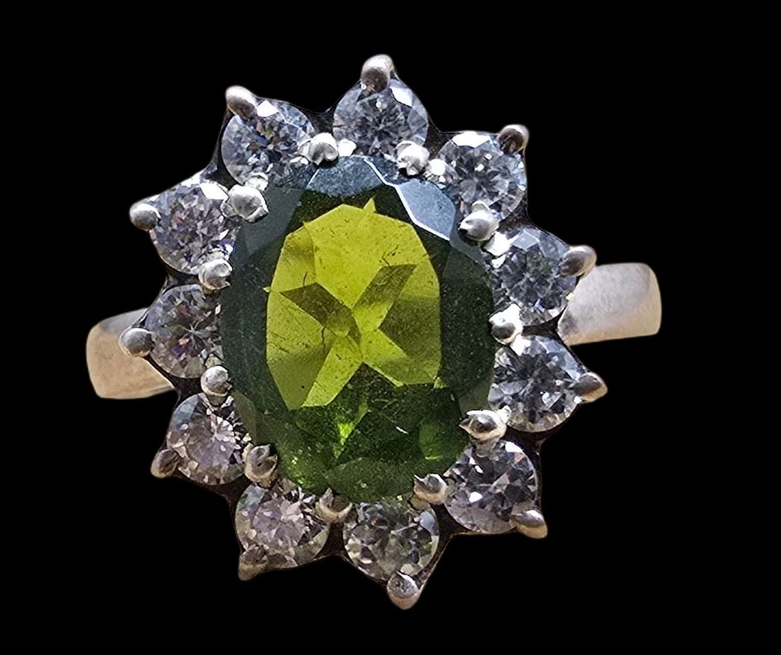 Beautiful Vintage Sterling Silver, Peridot & Clear Rhinestone Ring: Very good vintage condition with minor patina according to age. The ring is a size 8.5 and weighs ca. 3.5 grams. Marked for Sterling Silver.
