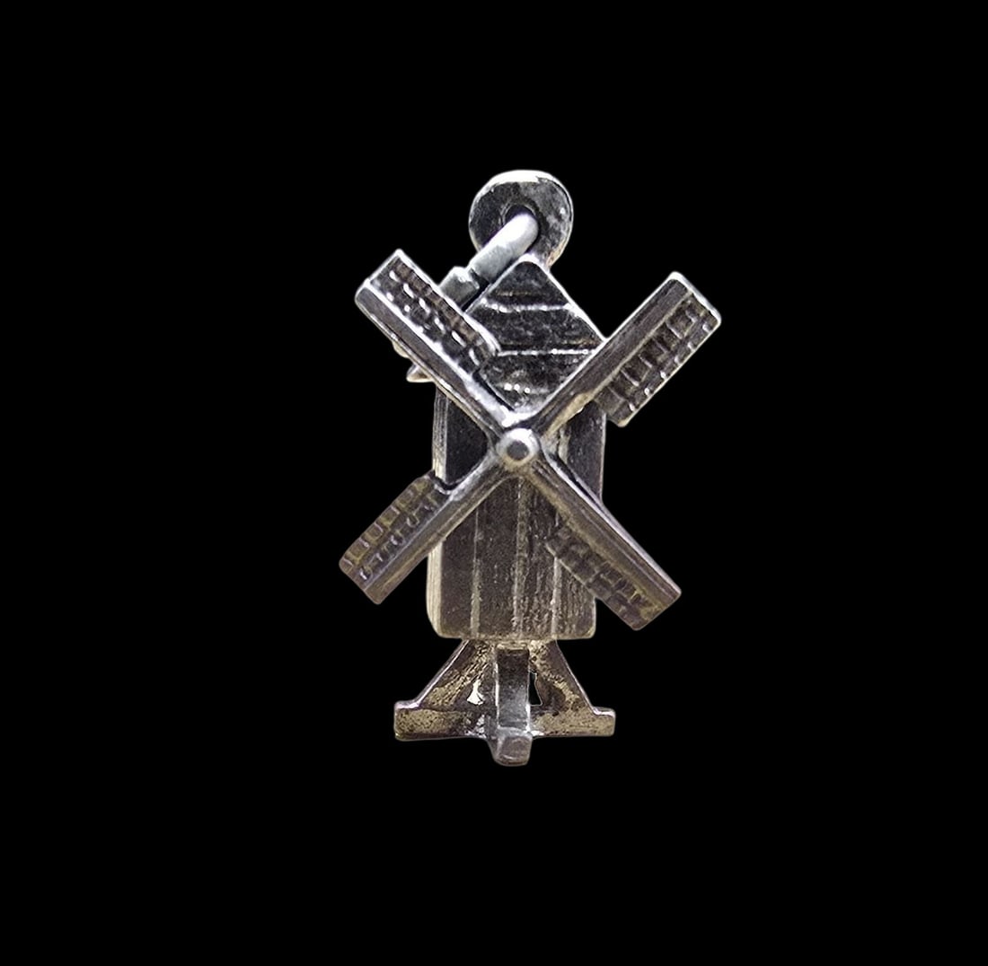 Whimsical Vintage Sterling Silver Mechanical Dutch Windmill Pendant Charm: Very good vintage condition with minor patina according to age. Measures approx. 1/2" wide and weighs ca. 2 grams. Tested for Sterling Silver.