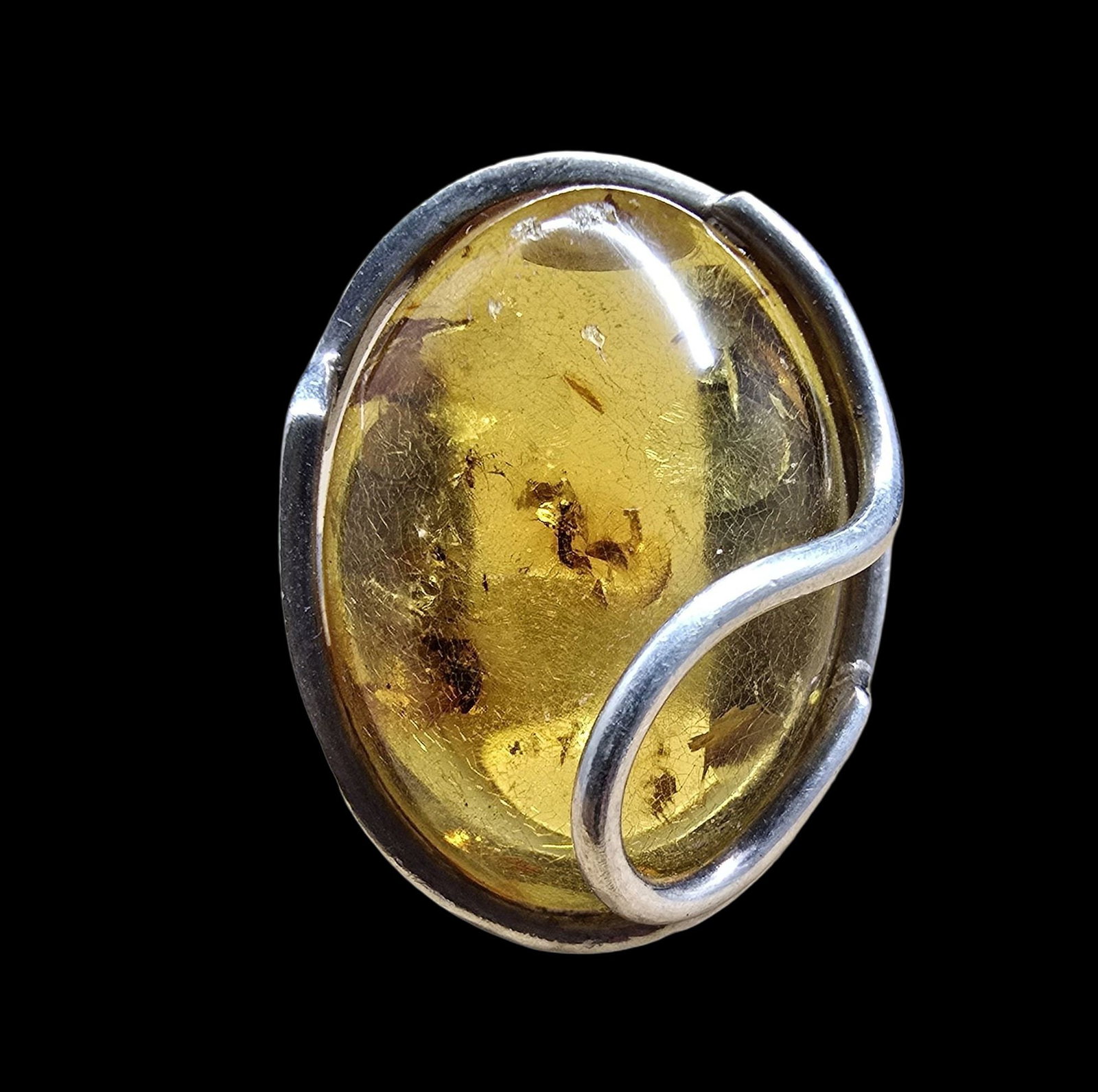 Stylish Vintage mid-Century Sterling Silver & Amber Cocktail Ring: Very good vintage condition with minor patina according to age. Measures approx. 1/2" wide and weighs ca. 9.5 grams. The ring is a size 9. Marked for Sterling Silver.