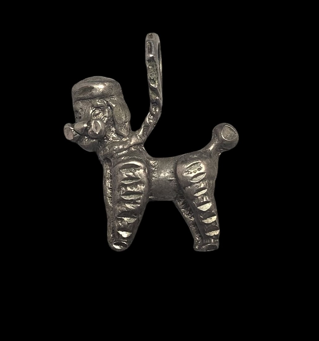 Vintage Sterling Silver Dog Pendant Charm: Very good vintage condition with minor patina and wear according to age. Measures approx. 1" wide and weighs ca. 3.5 grams. Marked for Sterling Silver..