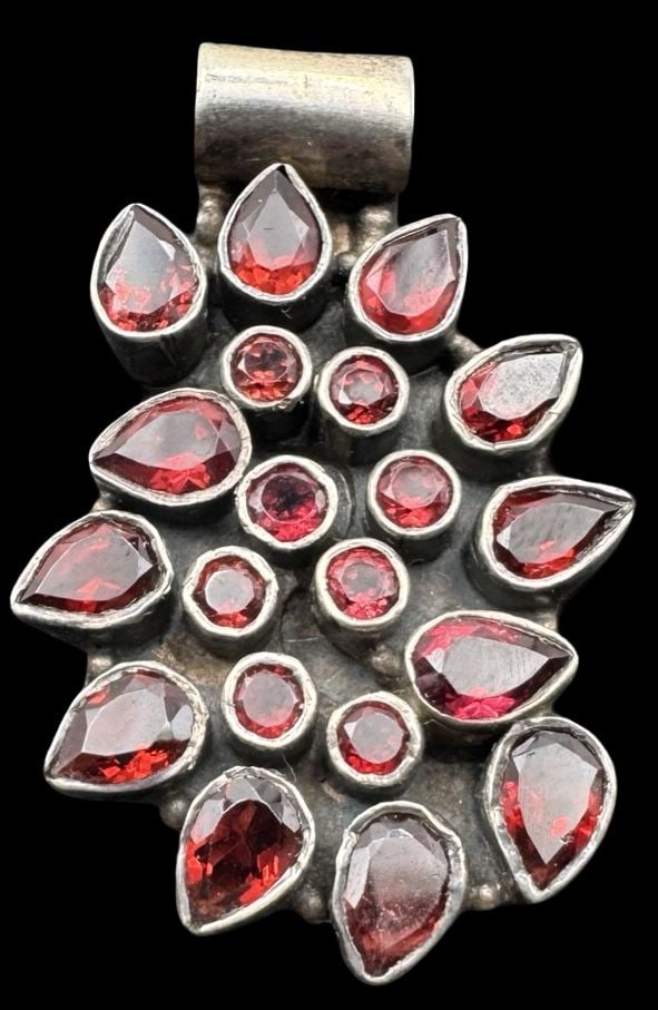 Stunning Vintage Sterling Silver & Garnet Cluster Pendant: Very good vintage condition with minor patina according to age. Measures approx. 1 1/2" long x 1" wide and weighs ca. 13.2 grams. Marked for Sterling Silver..