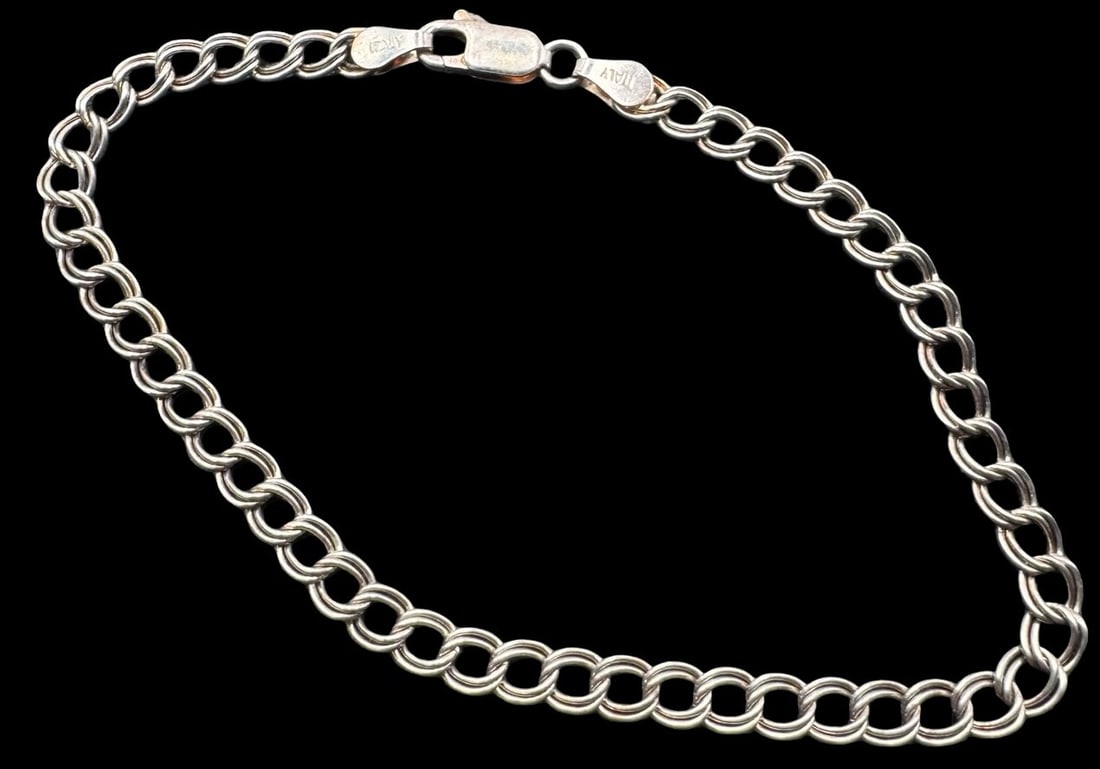 Stylish Vintage Italian Sterling Silver Bracelet: Very good vintage condition with minor patina according to age. Measures approx. 8" long x 3/16" wide and weighs ca. 4.4 grams. Marked for Sterling Silver.. Made in Italy.