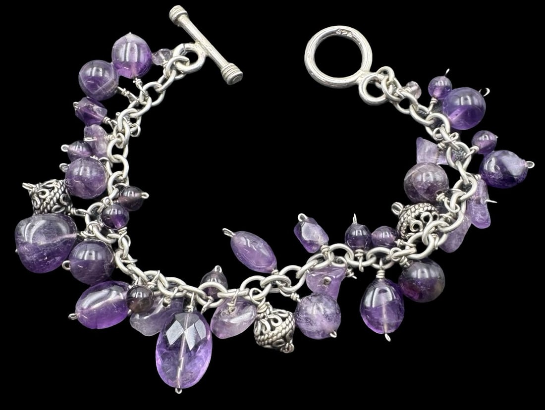 Beautiful Vintage Sterling Silver & Amethyst Toggle Bracelet: Very good vintage condition with minor patina according to age. Measures approx. 7 1/2" long and 3/4" wide and weighs ca. 28.4 grams. Marked for Sterling Silver..