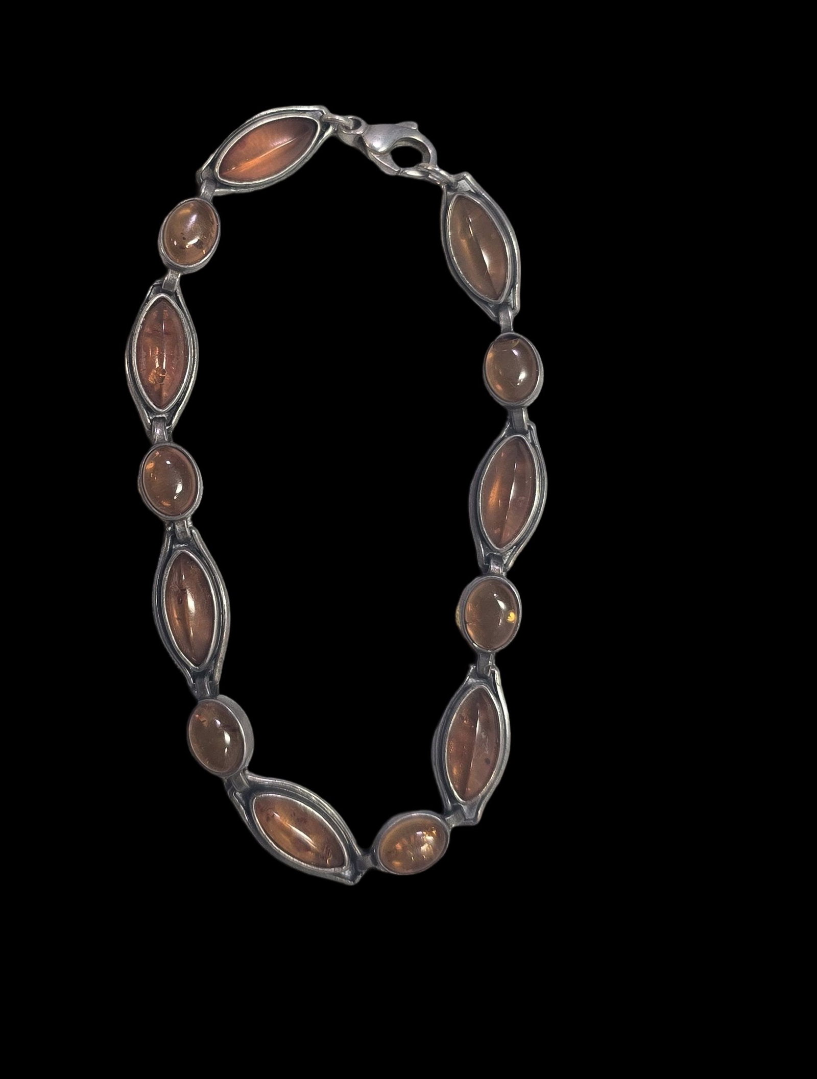 Vintage Mid-Century European 800 Silver & Baltic Amber Bracelet: Very good vintage condition with minor patina and wear according to age. Measures approx. 4" wide and weighs ca. 13.5 grams. Tested for a minimum of 800 (80%) silver.