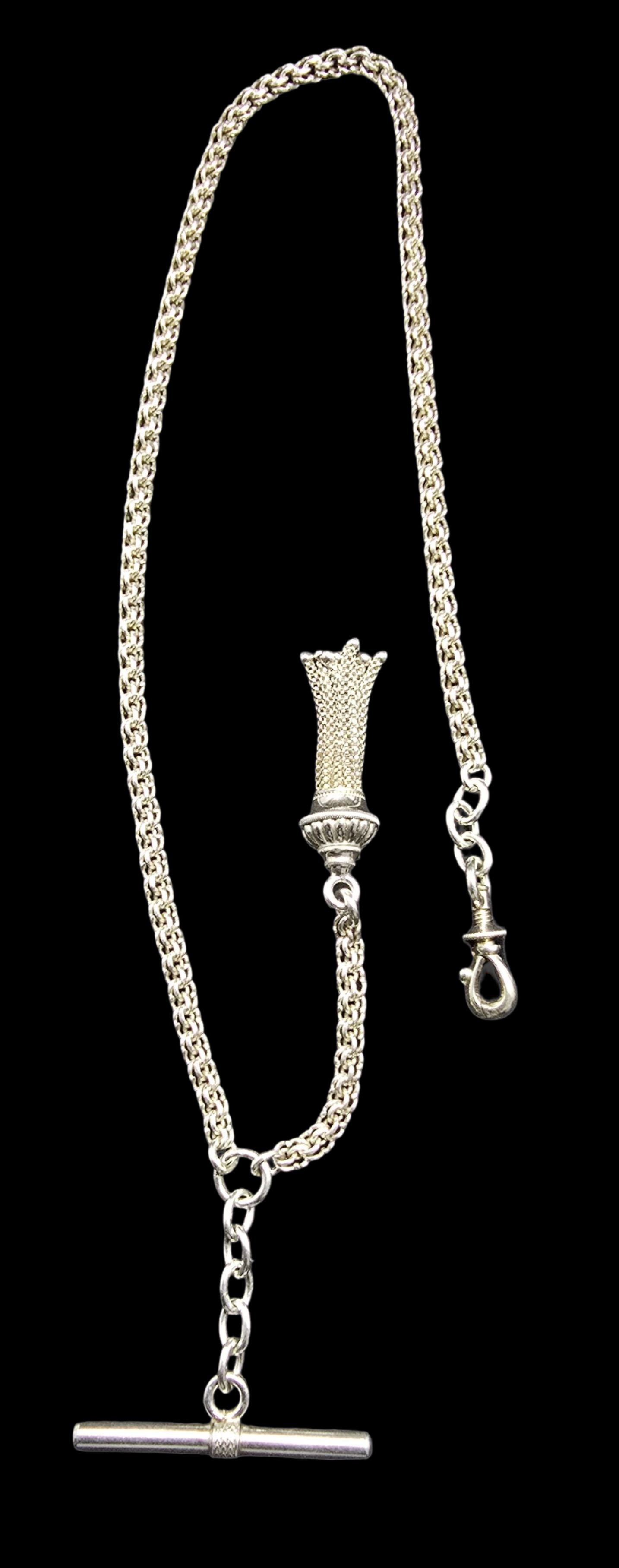 Beautiful Antique Sterling Silver Pocket Watch Chain /w T-Clasp & Tassel Fob: Very good antique condition with minor patina according to age. Measures approx. 12" long and 1" wide and weighs ca. 13 grams. Marked for Sterling Silver.