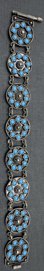 Ornate Vintage 935 Silver & Blue Gemstone Flower Shaped Panel Bracelet: Very good vintage condition with minor patina according to age. Measures approx. 6 3/4" long x 3/4" wide and weighs ca. 14.6 grams. Marked for 935 Silver.