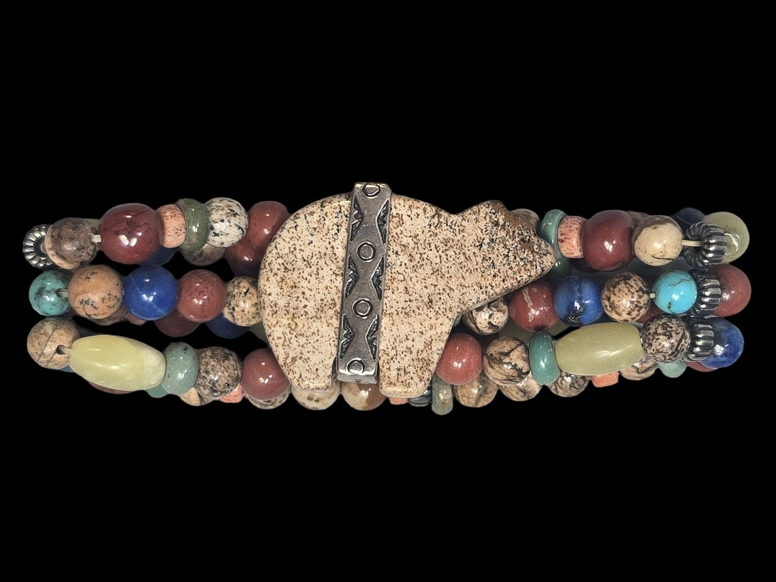 Vintage CAROLYN POLLACK Sterling Silver & Gemstone Beaded Bear Fetish Stretch Bracelet: Very good vintage condition with some patina and wear according to age. Measures approx. 4" wide and weighs ca. 34 grams. Marked.
