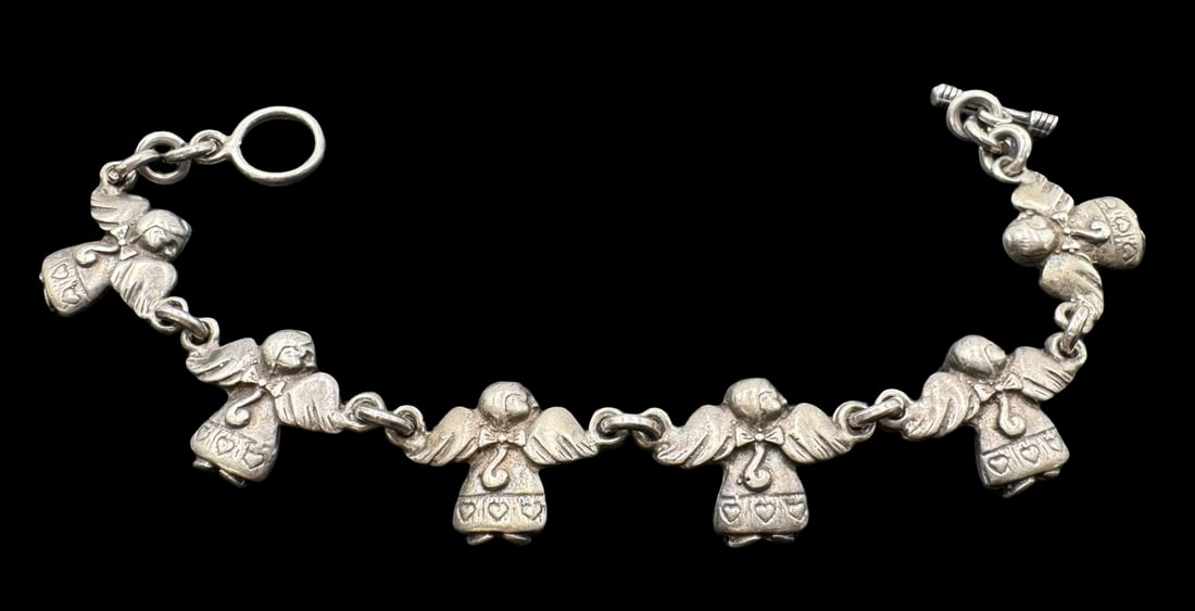Unusual Vintage Mexican Sterling Silver Angel Charm Bracelet: Very good vintage condition with minor patina according to age. Measures approx. 8" long x 3/4" wide and weighs ca. 26.4 grams. Marked for Sterling Silver. & Mexico.