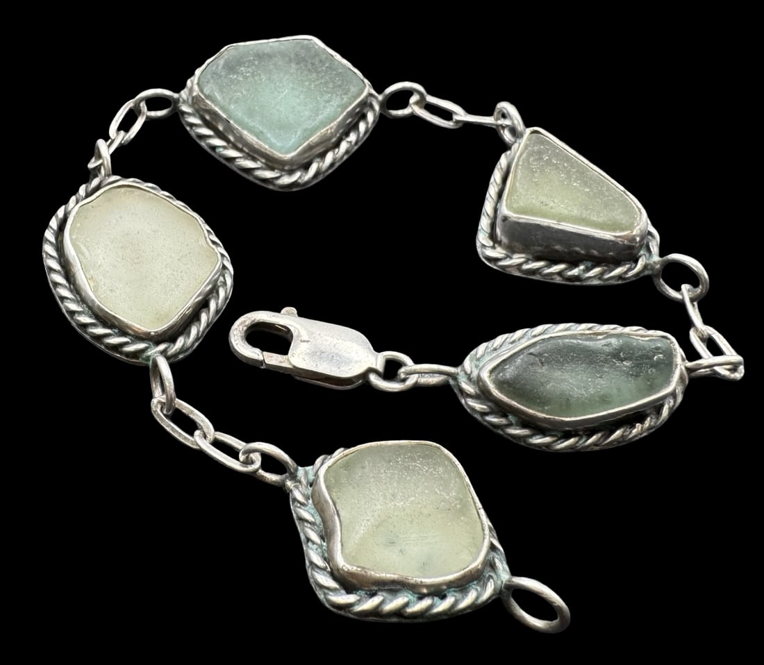 Beautiful Vintage Sterling Silver & Ocean Glass Bracelet: Very good vintage condition with minor patina according to age. Measures approx. 8 3/4" long x 7/8" wide and weighs ca. 31.1 grams. Marked for Sterling Silver..