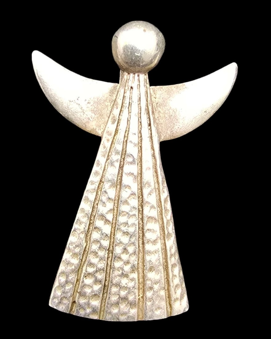 Beautiful Vintage Sterling Silver Designer Angel Pendant: Very good vintage condition with minor patina according to age. Measures approx. 1/2" wide and weighs ca. 0.2 grams. Marked for Sterling Silver.