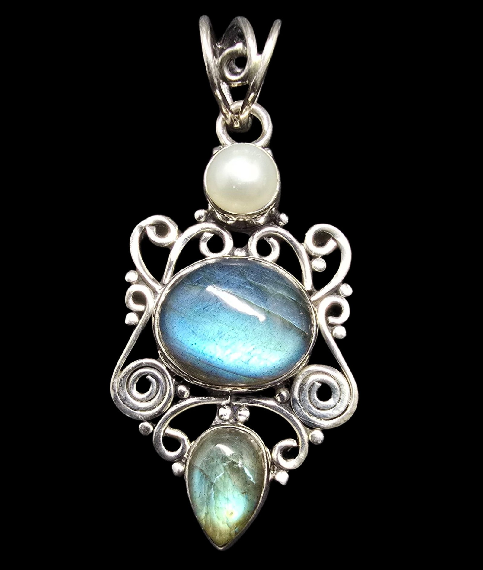Unusual Ornate Vintage Sterling Silver, Labradorite & White Pearl Pendant: Very good vintage condition with minor patina according to age. Measures approx. 1" wide and weighs ca. 5 grams. Marked for Sterling Silver.