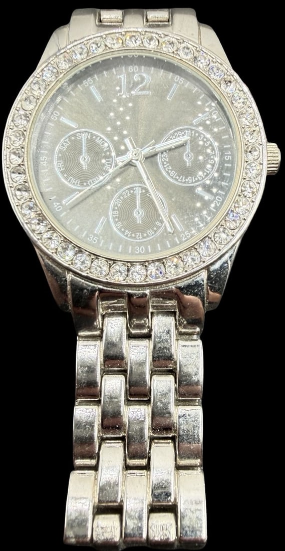 Gorgeous Vintage MERONA Stainless Steel & Clean Rhinestone Quartz Watch: Very good vintage condition with minor patina according to age. Measures approx. 1" long and 1" wide. Marked for MERONA. Watch isn't working.