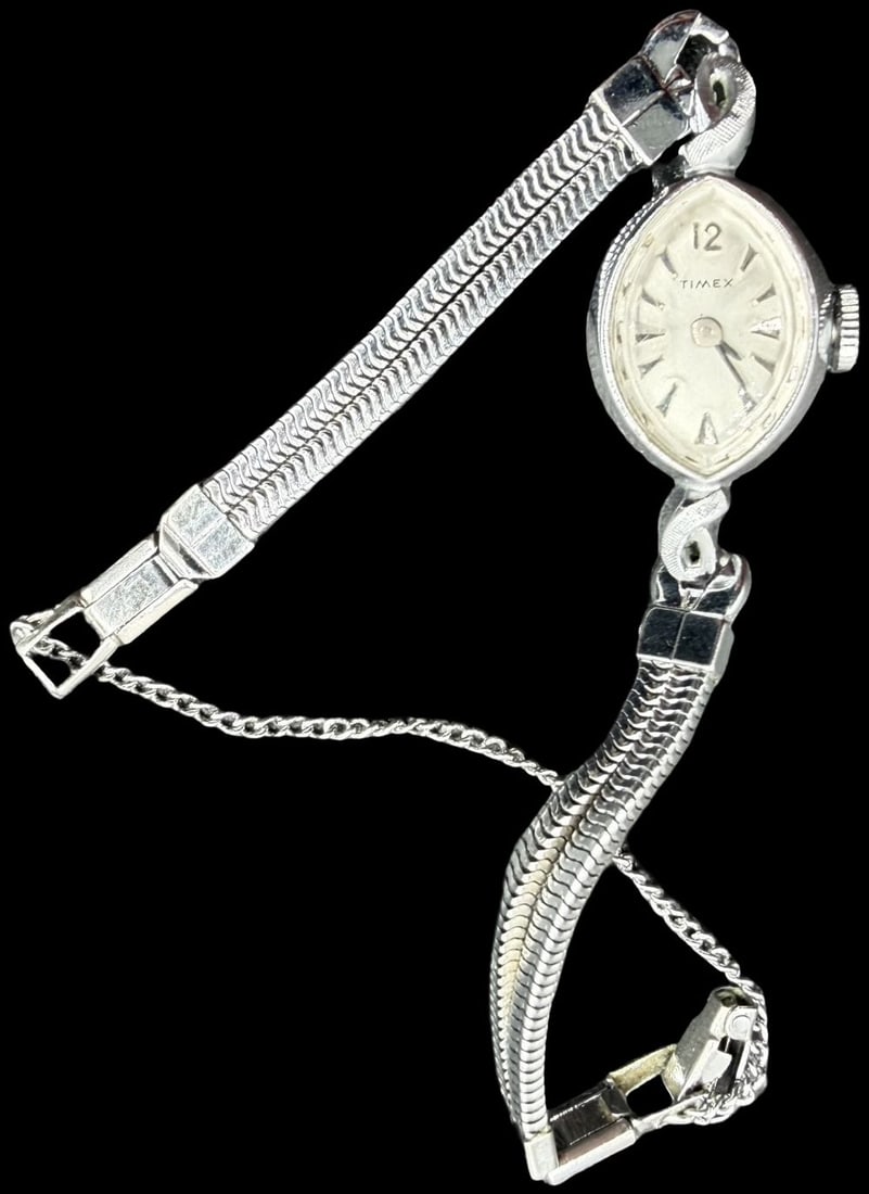 Gorgeous Vintage TIMEX Stainless Steel Silver Tone & Silver Strap Watch: Very good vintage condition with minor patina according to age. Measures approx. 3/4" long and 1/2" wide. Marked for TIMEX. Watch isn 't working.