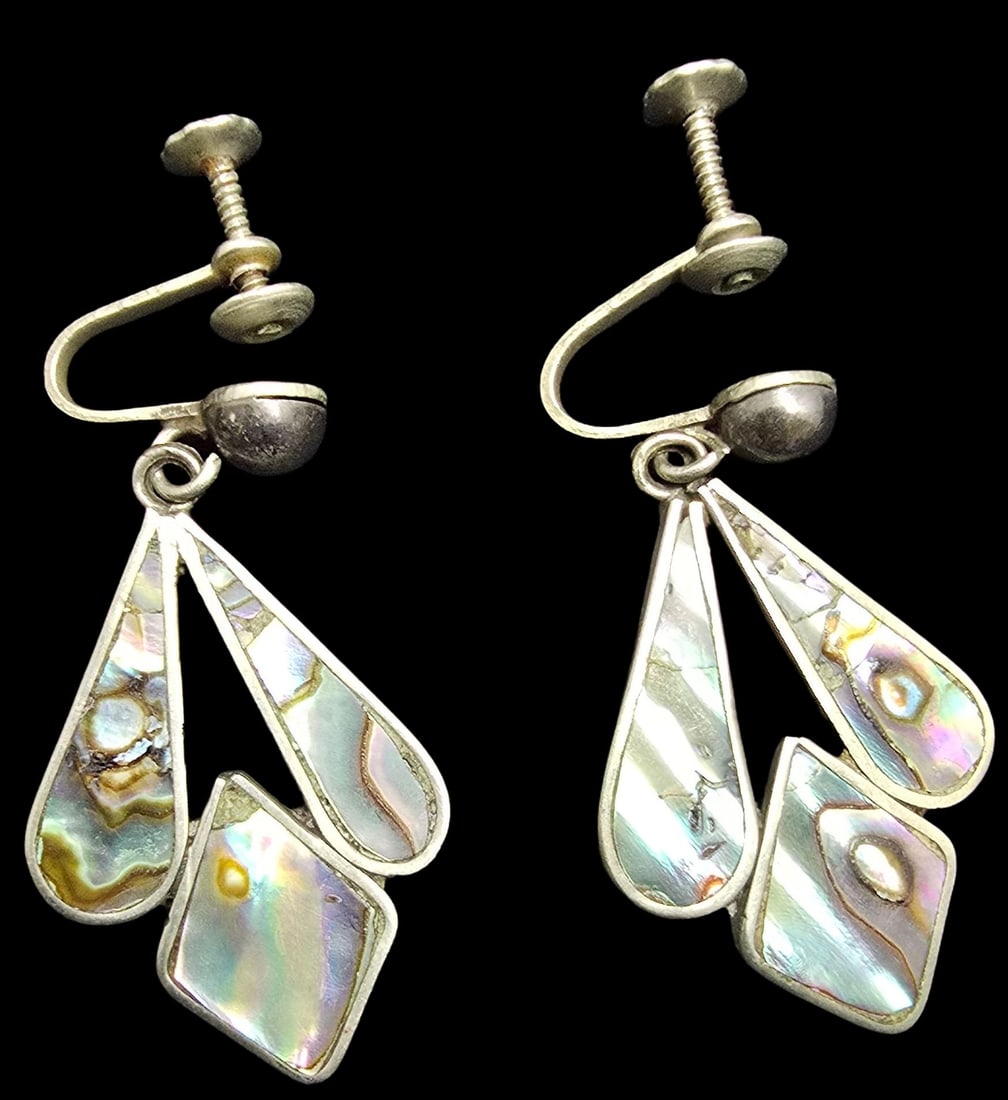 Unusual Vintage Mexican Sterling Silver & MOP Designer Earrings: Very good vintage condition with minor patina according to age. Each measures approx. 1" high x 1/2" wide and they jointly weigh ca. 3.5 grams. Marked for Sterling Silver & Designer.