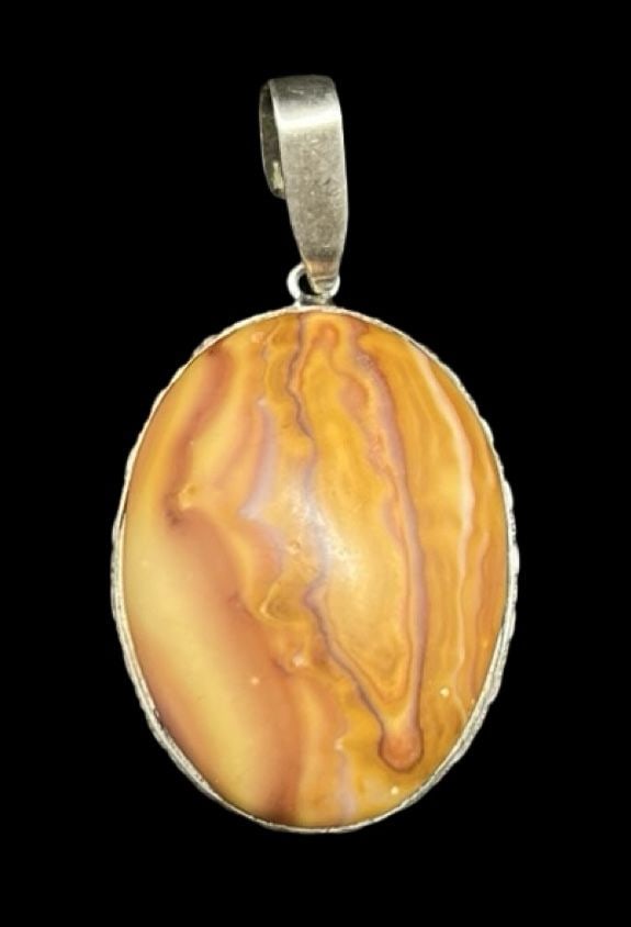Beautiful Vintage Sterling Silver & Orange Gemstone Pendant: Very good vintage condition with minor patina according to age. Measures approx. 1 3/4" long and 1" wide and weighs ca. 10.1 grams. Marked for Sterling Silver.