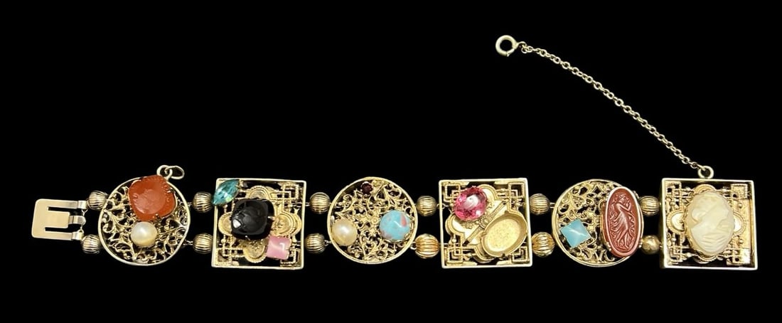 Stunning Ornate Vintage Gilt Metal, Multi-Color Gemstones & Intaglios Costume Jewelry Panel Bracelet: Very good vintage condition with minor patina according to age. Measures approx. 7 1/2" long and 1" wide and weighs ca. 69.6 grams. Missing a Stone.