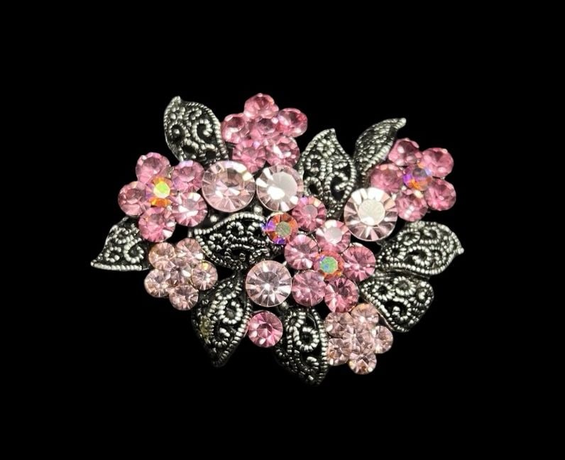 Beautiful Ornate Vintage Silver-Tone Metal & Clustered Pink Rhinestones Brooch: Very good vintage condition with minor patina according to age. Measures approx. 1 3/8" long and 1 3/4" wide and weighs ca. 12.4 grams.