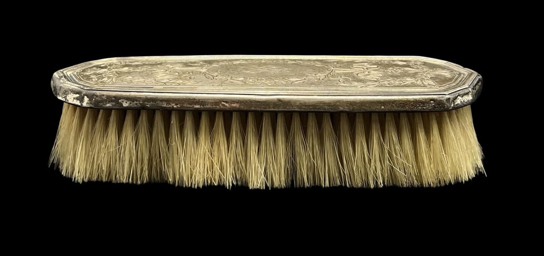 Antique Ornately Engraved Sterling Silver Bristle Brush: Very good vintage condition with minor patina according to age. Measures approx. 7 1/4" long and 2 1/8" wide and weighs ca. 111.2 grams. Marked for Sterling Silver.