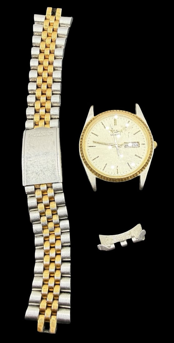 Gorgeous Vintage PULSAR Stainless Steel Gold & Silver Tone Quartz Watch: Very good vintage condition with minor patina according to age. Dial measures approx. 1" long and 1" wide. Marked for PULSAR. The watch is currently not working and disassembled