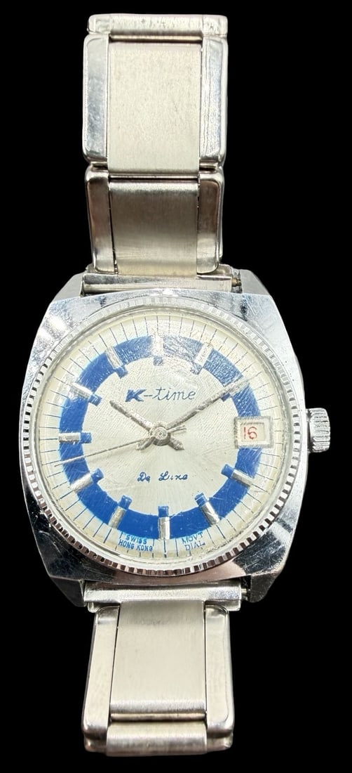 Vintage Mid-Century K-TIME Stainless Steel Gold Tone & Blue/White Dial Watch: Very good vintage condition with minor patina according to age. Dial measures approx. 1" long and 1" wide. Marked for K-TIME. The timepiece is working and features an elastic strap.