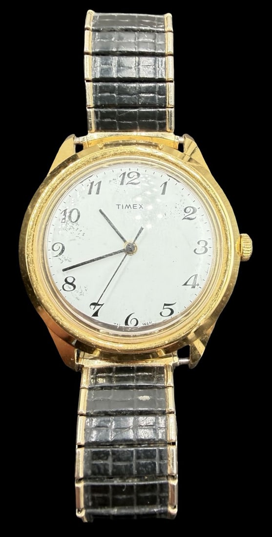 Vintage TIMEX Stainless Steel Gold Tone & White Dial Watch.: Very good vintage condition with minor patina according to age. Dial measures approx. 1 1/4" long and 1 1/4" wide. Marked for TIMEX. The timepiece is working and features an elastic strap.