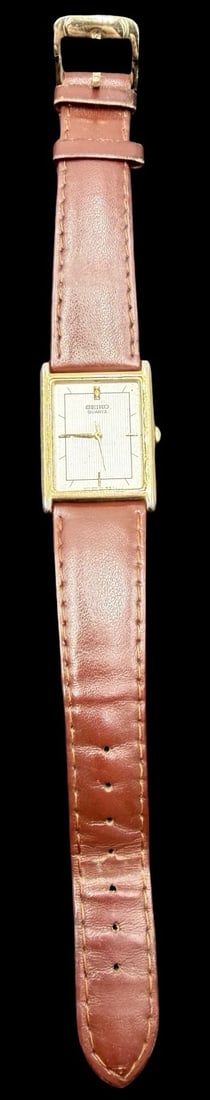 Vintage Mid-Century SEIKO Stainless Steel Gold Tone /w Brown Leather Strap Quartz Watch.: Very good vintage condition with minor patina according to age. Dial measures approx. 1" long and 3/4" wide. Marked for SEIKO. The watch is currently not working.