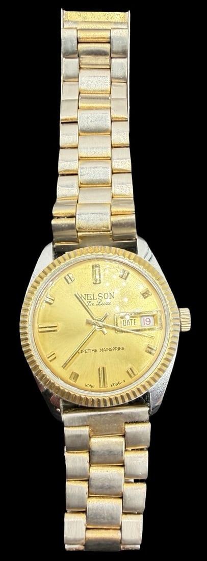 Vintage NELSON De Luxe Stainless Steel Gold Tone Quartz Watch: Very good vintage condition with minor patina according to age. Dial measures approx. 1 1/4" long and 1 1/4" wide and weighs ca. 72.18 grams. Marked for NELSON. The watch is functional.