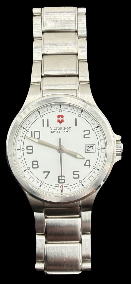 Vintage VICTORINOX Swiss Army Stainless Steel Silver Tone Watch: Very good vintage condition with minor patina according to age. Dial measures approx. 1 1/4" long and 1 1/4" wide and weighs ca. 99.15 grams. Marked for VICTORINOX. The watch is functional. Made in Sw