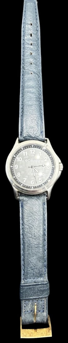 Gorgeous COLUMBIA Stainless Steel Silver Tone & Black Dial Watch: Very good vintage condition with minor patina according to age. Dial measures approx. 1 1/4" long and 1 1/4" wide. Marked for COLUMBIA. The timepiece is functional and features an elastic strap.