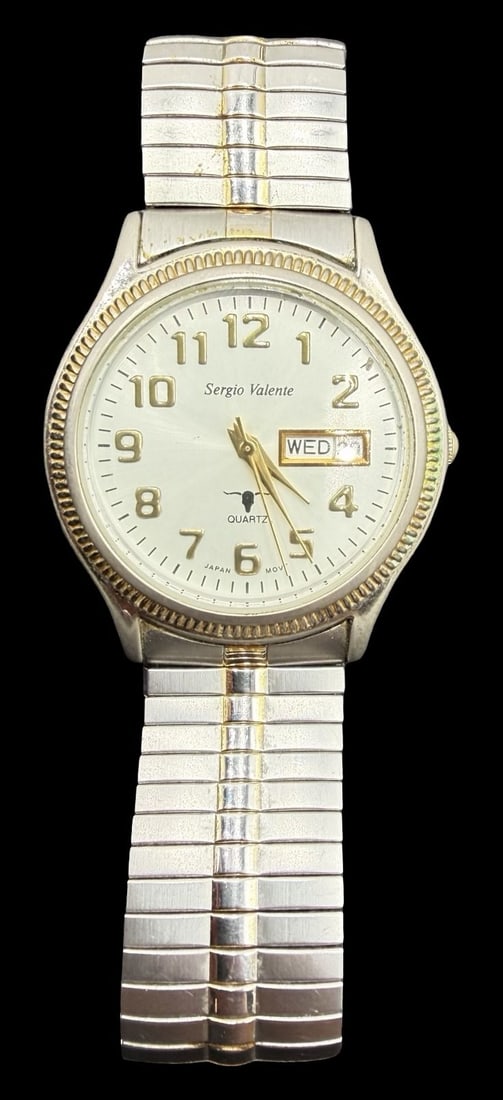 Vintage SERGIO VALENTE Stainless Steel Gold Tone Quartz Watch: Very good vintage condition with minor patina according to age. Dial measures approx. 1" long and 1" wide and weighs ca. 56.57 grams. Marked for SERGIO VALENTE. The timepiece is functional and feature