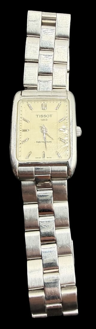 Vintage TISSOT 1853 Stainless Steel Silver Tone Watch: Very good vintage condition with minor patina according to age. Dial measures approx. 3/4" long and 1/2" wide and weighs ca. 52.83 grams. Marked for TISSOT. The timepiece is working. Made in Switzerla