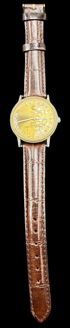 Vintage OMEGA Gold Tone & Clear Rhinestone Watch: Very good vintage condition with minor patina according to age. Dial measures approx. 1 1/4" long and 1 1/4" wide and weighs ca. 30.71 grams. Marked for OMEGA. The timepiece is currently not working.