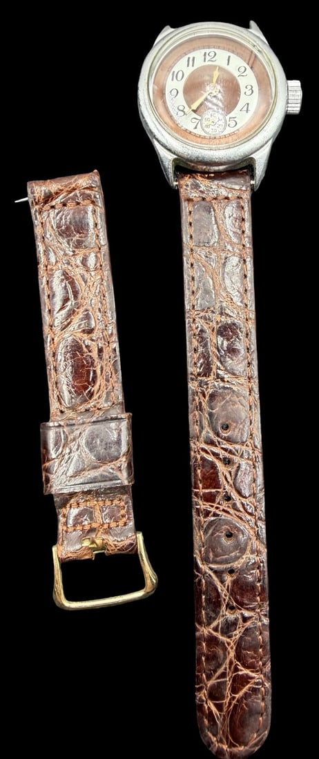 Vintage GENEVE Silver Tone & Brown Dial Watch: Very good vintage condition with minor patina according to age. Dial measures approx. 1" long and 1" wide and weighs ca. 31.50 grams. Marked for GENEVE. The timepiece is currently not working. Strap i
