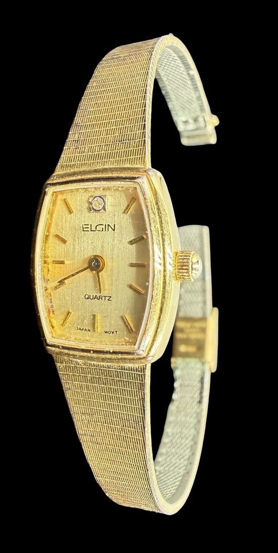 Vintage ELGIN Stainless Steel Gold Tone /w Clear Rhinestone Quartz Watch: Very good vintage condition with minor patina according to age. Dial measures approx. 3/4" long and 1/2" wide and weighs ca. 19.47 grams. Marked for ELGIN. The timepiece is currently not working.