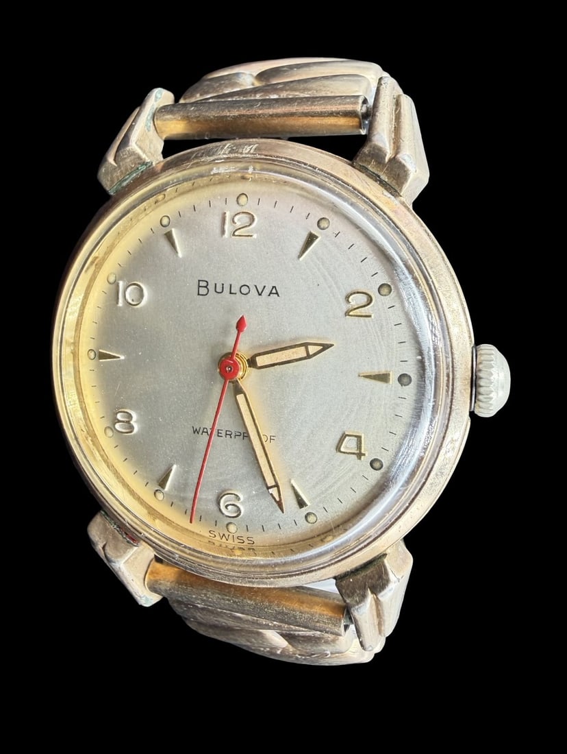 Vintage Mid-Century BULOVA Gold Filled & Beige Dial Wristwatch: Very good vintage condition with minor patina according to age. Dial measures approx. 1" long and 1" wide and weighs ca. 39.53 grams. Marked for BULOVA. The timepiece is functional and features an ela