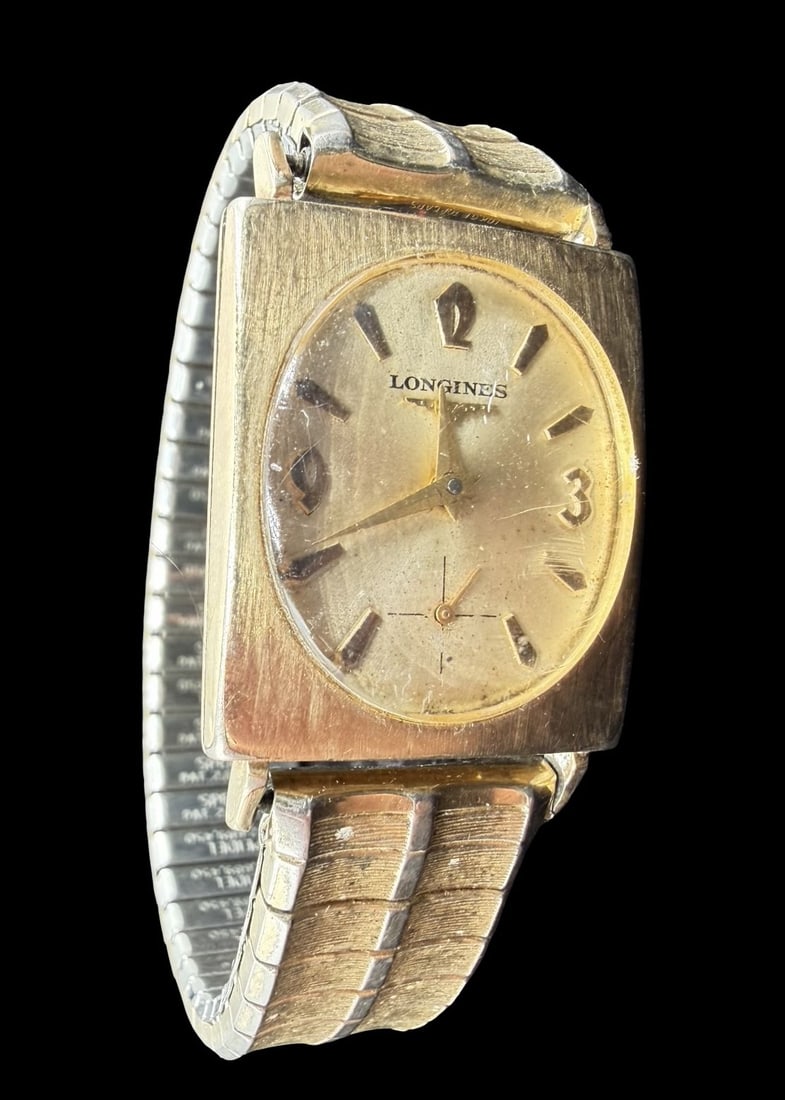 Vintage Mid-Century LONGINES Gold Filled Wristwatch: Very good vintage condition with minor patina according to age. Dial measures approx. 1" long and 3/4" wide and weighs ca. 46.83 grams. Marked for LONGINES. The timepiece is currently not working and 