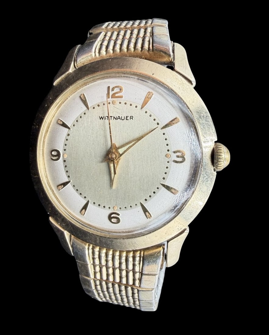 Vintage Mid-Century WITTNAUER Gold Filled Ladies Wristwatch: Very good vintage condition with minor patina according to age. Dial measures approx. 1" long and 1" wide and weighs ca. 56.70 grams. Marked for WITTNAUER. The timepiece is working and features an ela