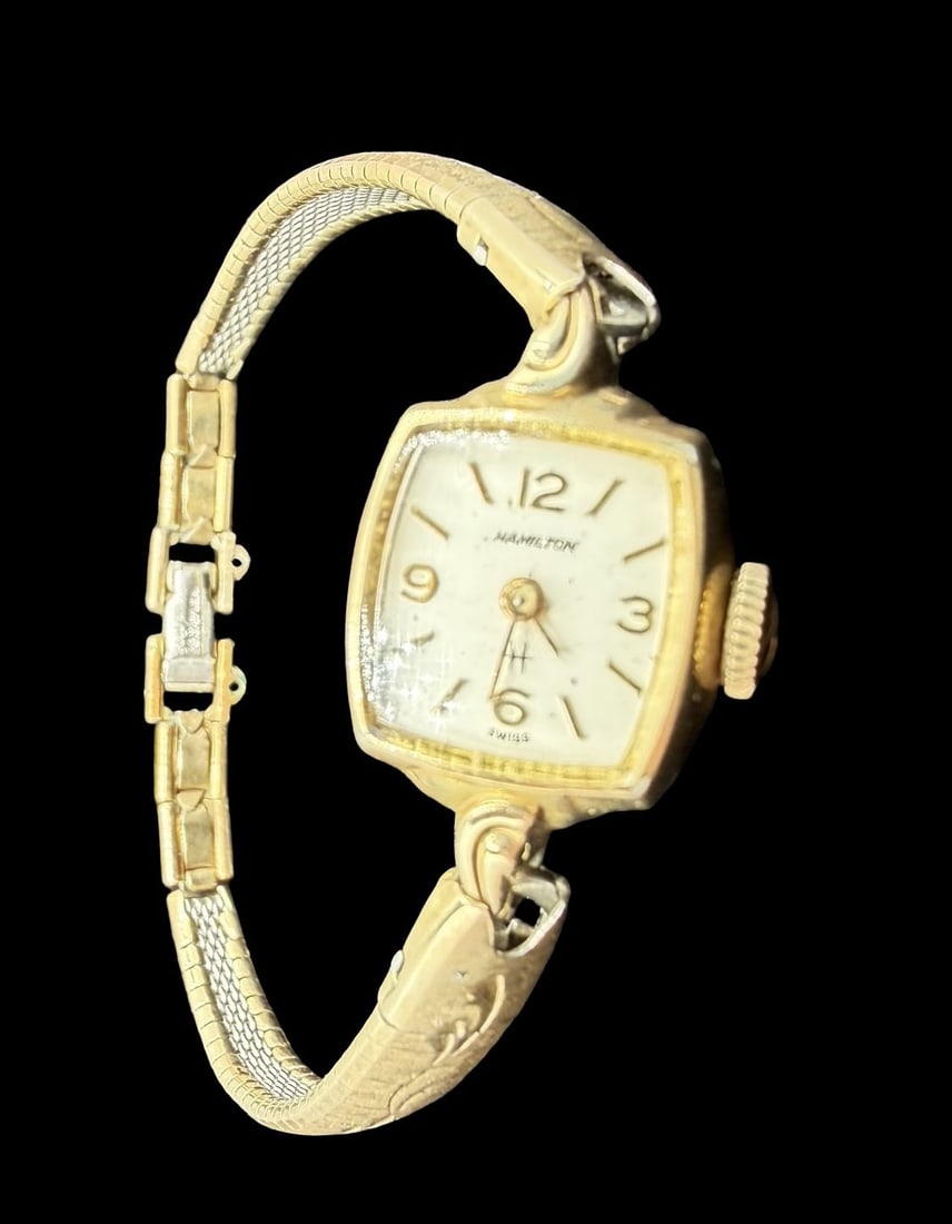 Vintage Mid-Century HAMILTON Gold Filled Ladies Wristwatch: Very good vintage condition with minor patina according to age. Dial measures approx. 1/2" long and 1/2" wide and weighs ca. 13.14 grams. Marked for HAMILTON. The timepiece is currently not working.